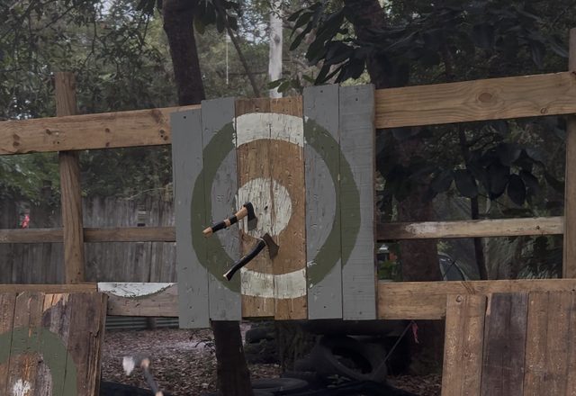Axes stuck in the outdoor throwing targets