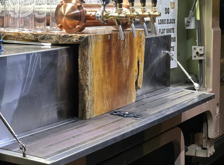 The bar setup inside the vehicle, taps and timber