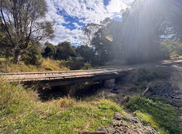 The timber bridge on the track through the property
