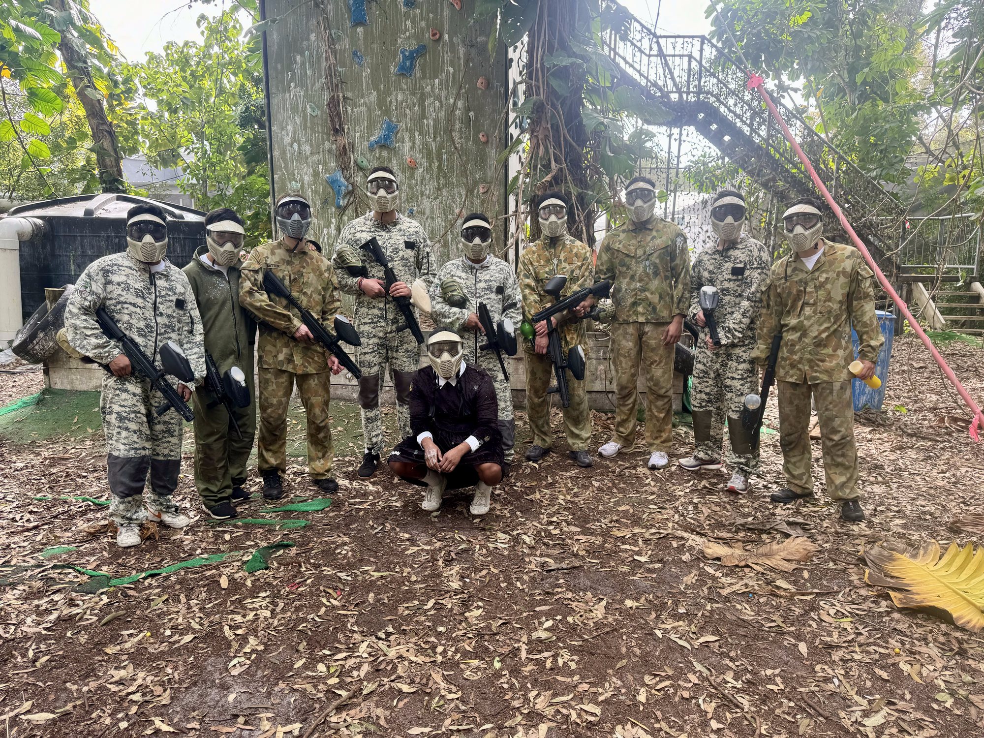 A bucks party group in camo and full gear before their session at XperiencesHQ