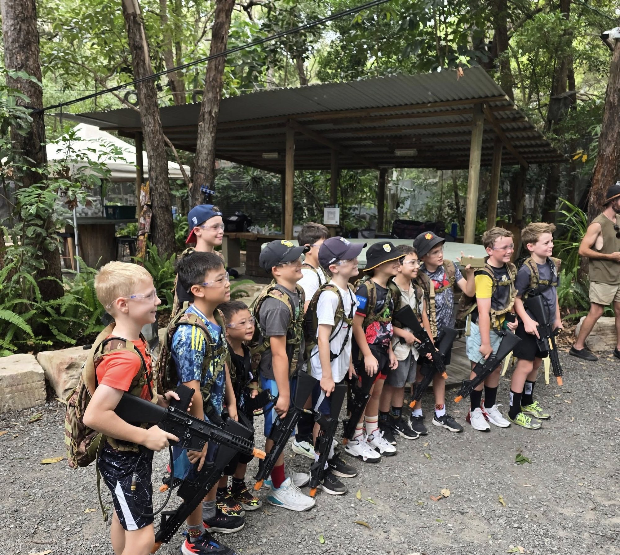 A birthday group lined up in camo gear before a gel blasting session at Twin Waters