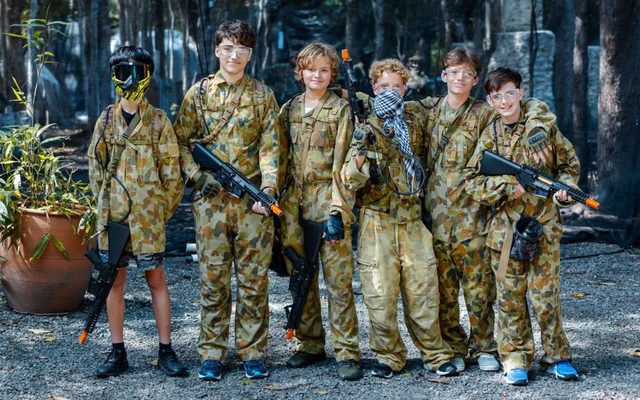 A kids' party team kitted out for gel blasting
