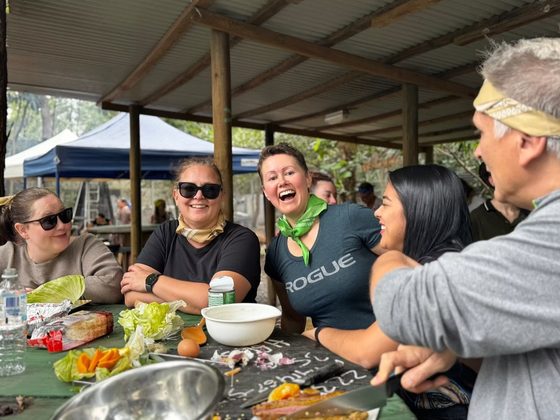 A team cooking their dish over an open fire during the cook-off