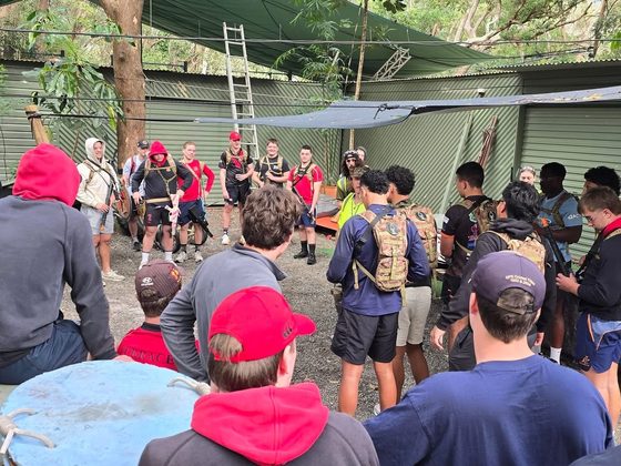 A large group briefing before small-sided games at HQ